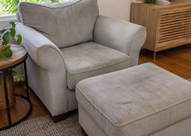 Soiled armchair before professional upholstery cleaning in a Sydney home